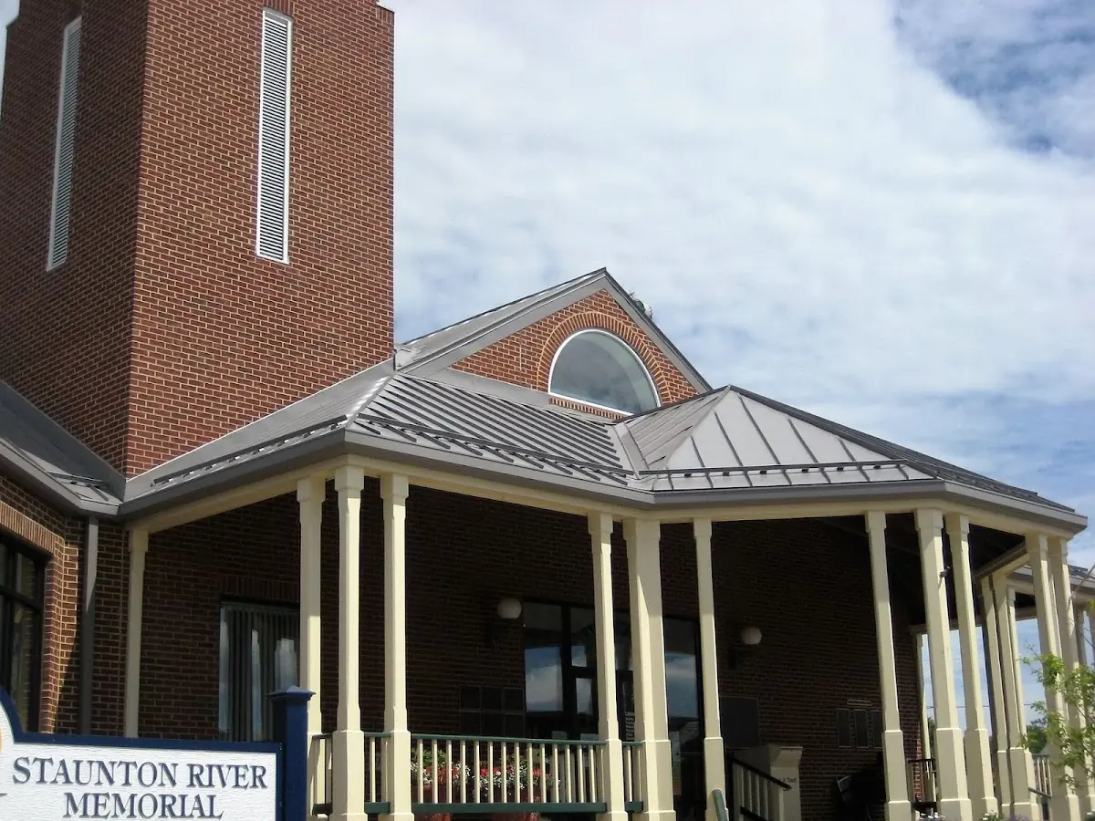 Skilled roofing craftsmen working on a residential roof in Deerlake Meadows